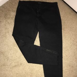 Black distressed skinny jeans with zippers